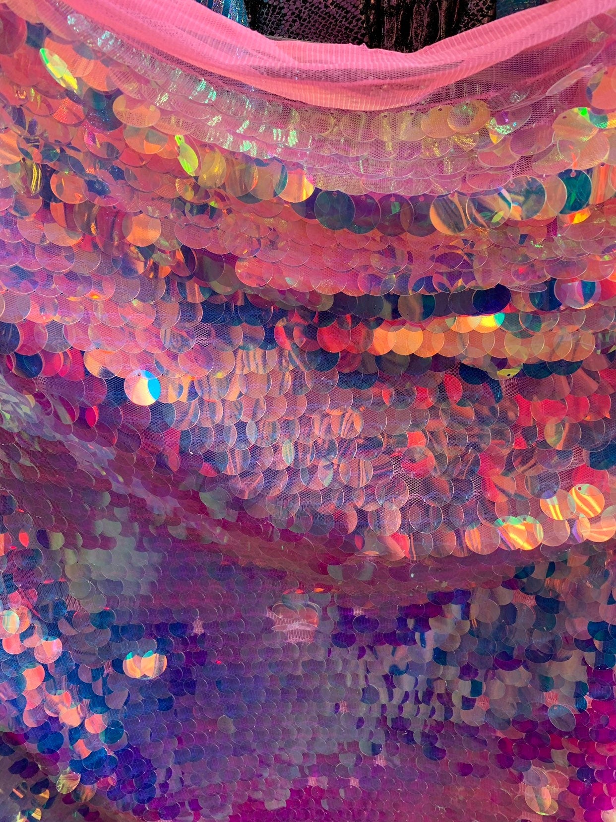 New iridescent pink sequins big paillette seq on stretch mesh 2-way 58/60" Sold by the YD. Ships worldwide from Los Angeles California USA.