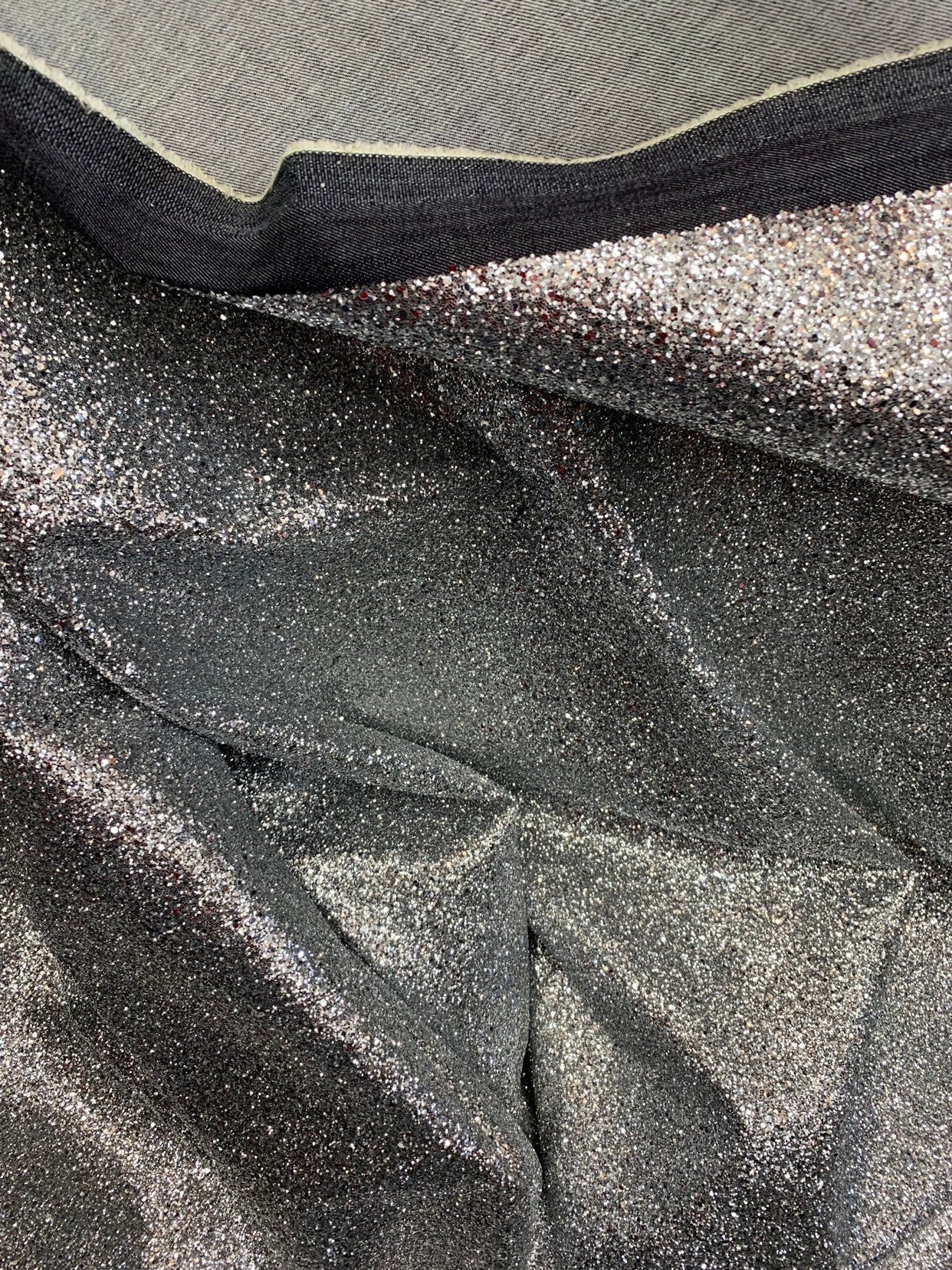 New denim fabric non stretch with silver metallic glitter all over 58/60" Sold by the YD. Ships worldwide from Los Angeles California USA.