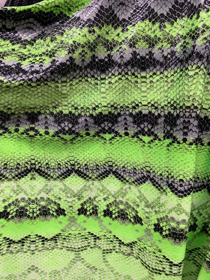 New exotic snake design poly spandex 4-way stretch with clear foil 58/60" Sold by the YD. Ships worldwide from Los Angeles California USA.