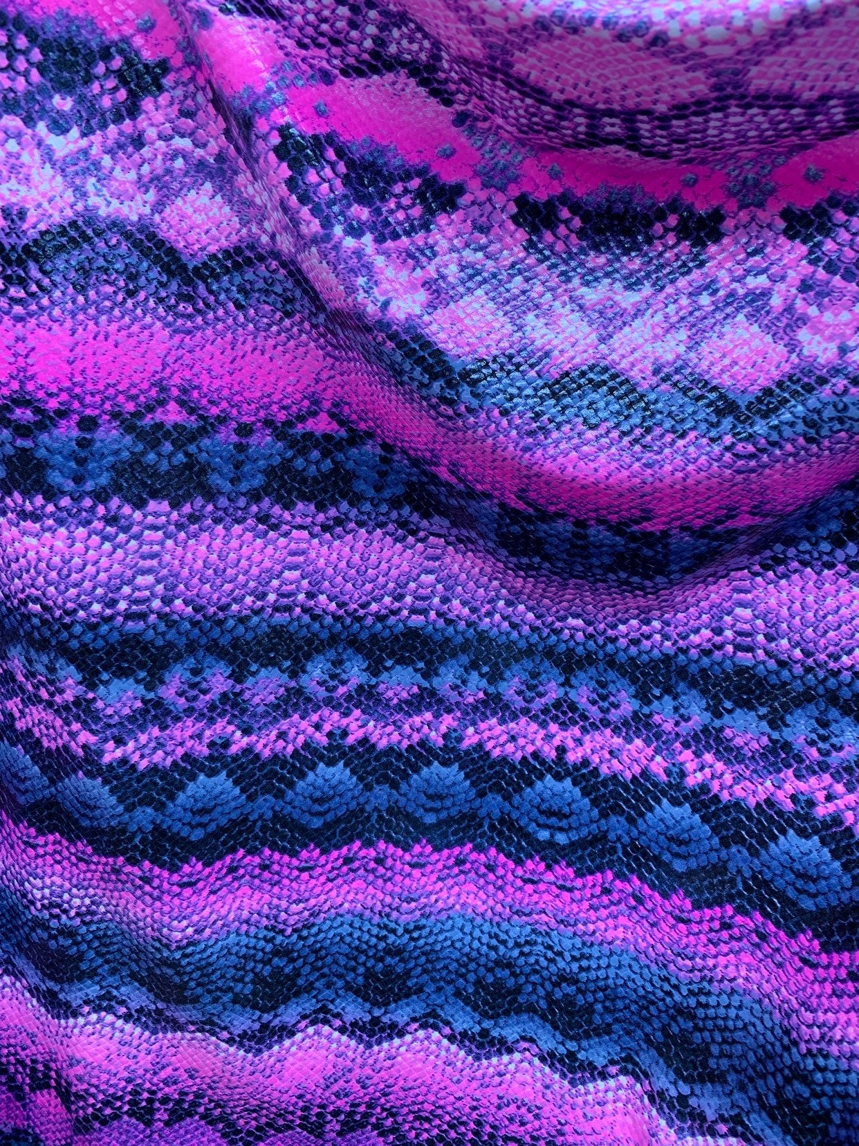 New exotic snake design poly spandex 4-way stretch with clear foil 58/60" Sold by the YD. Ships worldwide from Los Angeles California USA.