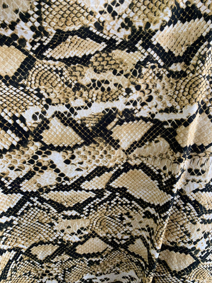 New print spandex cobra design Brush print spandex 4way stretch 58/60" Sold by the YD. Ships worldwide from Los Angeles California USA.