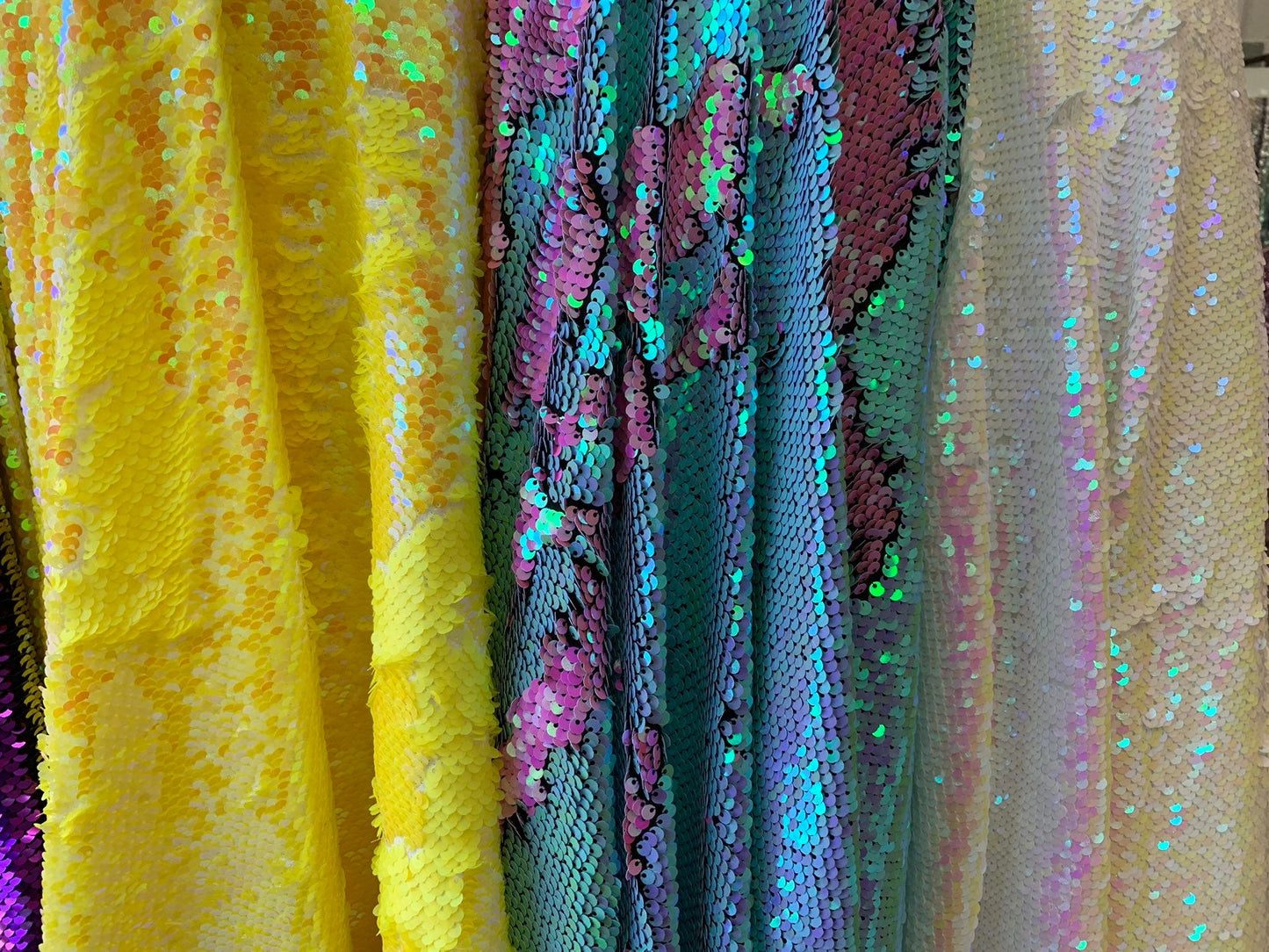 New flip up mermaid reversible sequins iridescent colors on spandex base 58/60" Sold by the YD. Ships worldwide from Los Angeles California