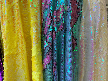 New flip up mermaid reversible sequins iridescent colors on spandex base 58/60" Sold by the YD. Ships worldwide from Los Angeles California