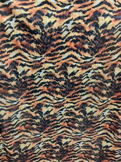 New Tiger Exotic design print on chiffon non stretch 58/60" Sold by the YD. Ships worldwide from Los Angeles California USA.