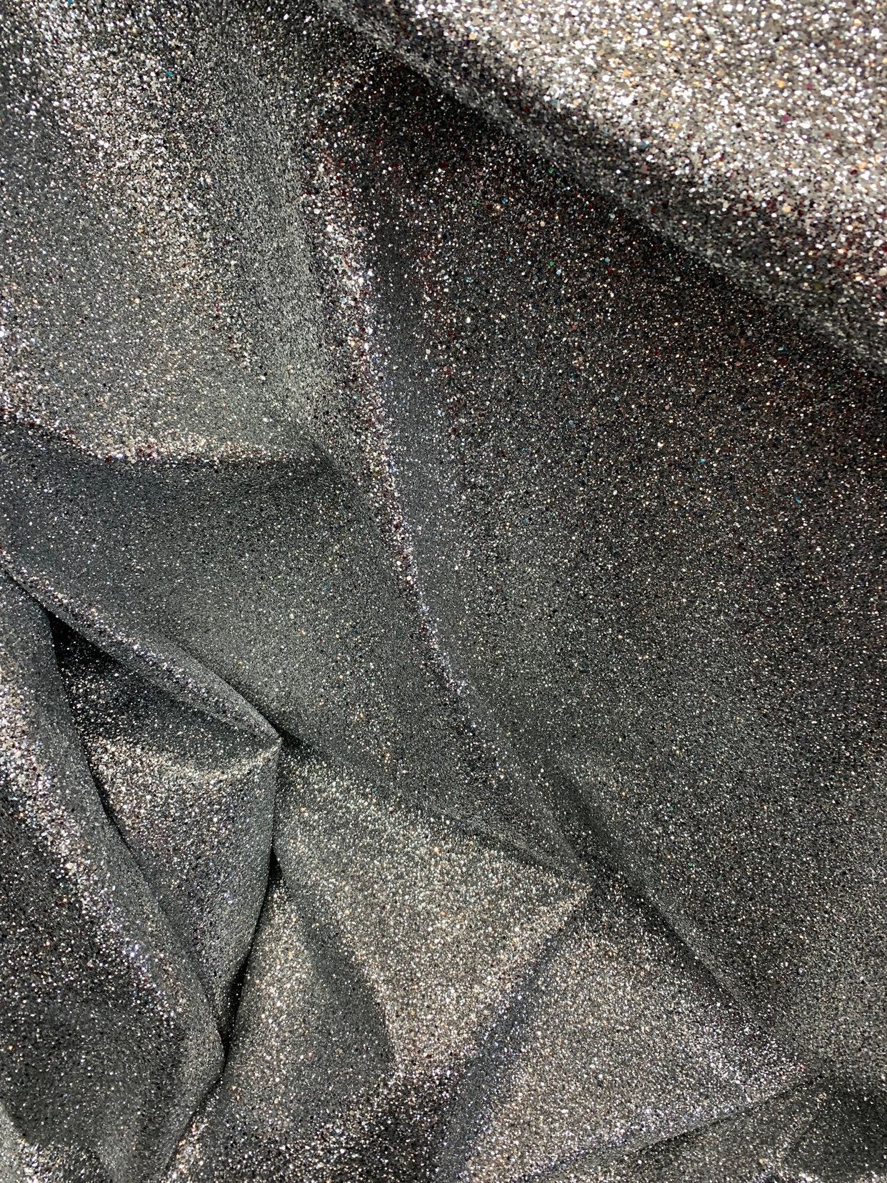 New denim fabric non stretch with silver metallic glitter all over 58/60" Sold by the YD. Ships worldwide from Los Angeles California USA.