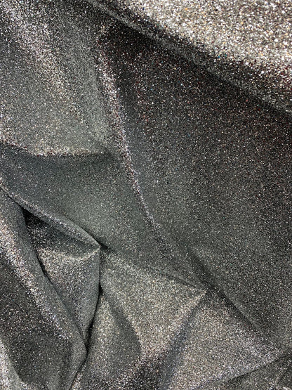 New denim fabric non stretch with silver metallic glitter all over 58/60" Sold by the YD. Ships worldwide from Los Angeles California USA.