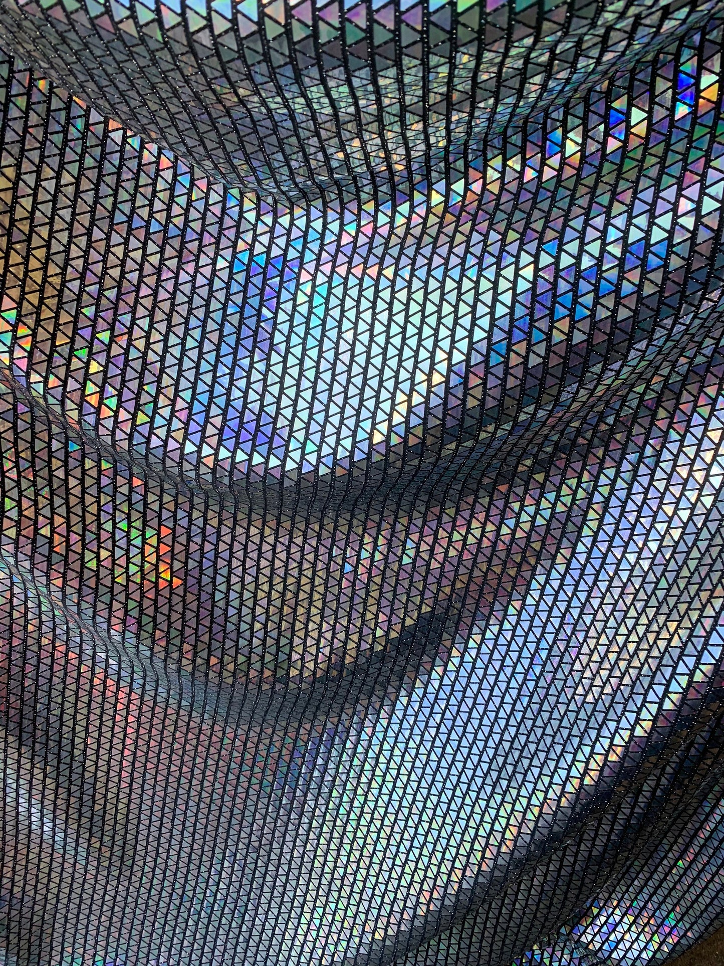 New triangle sequins Hologram Iridescent black on metallic base non stretch 58/60" Sold by the YD. Ships worldwide from Los Angeles C.A USA.