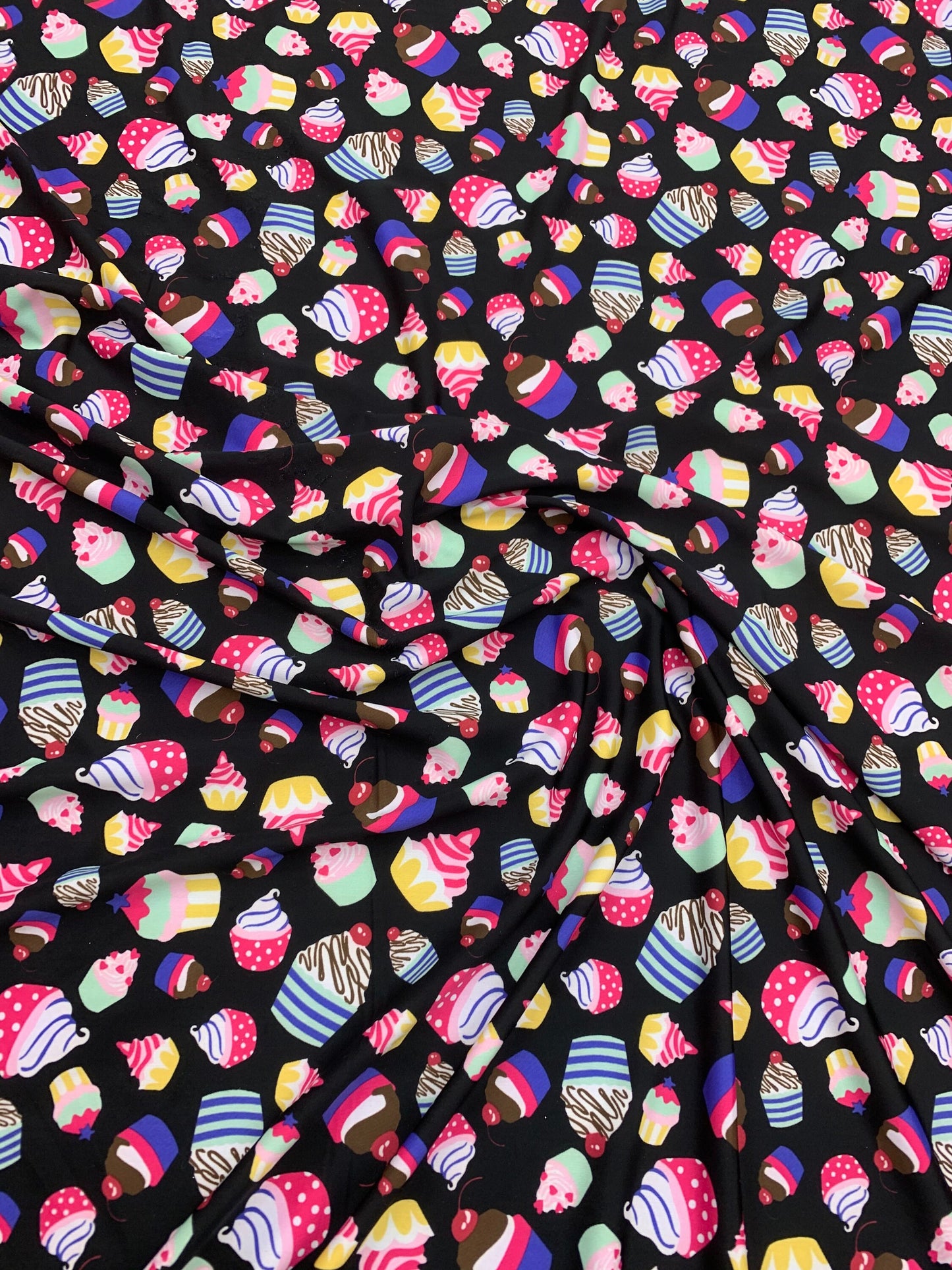 New cupcakes design print on nylon spandex finest quality 4-way stretch 58/60” Sold by the YD. Ships worldwide from Los Angeles California.