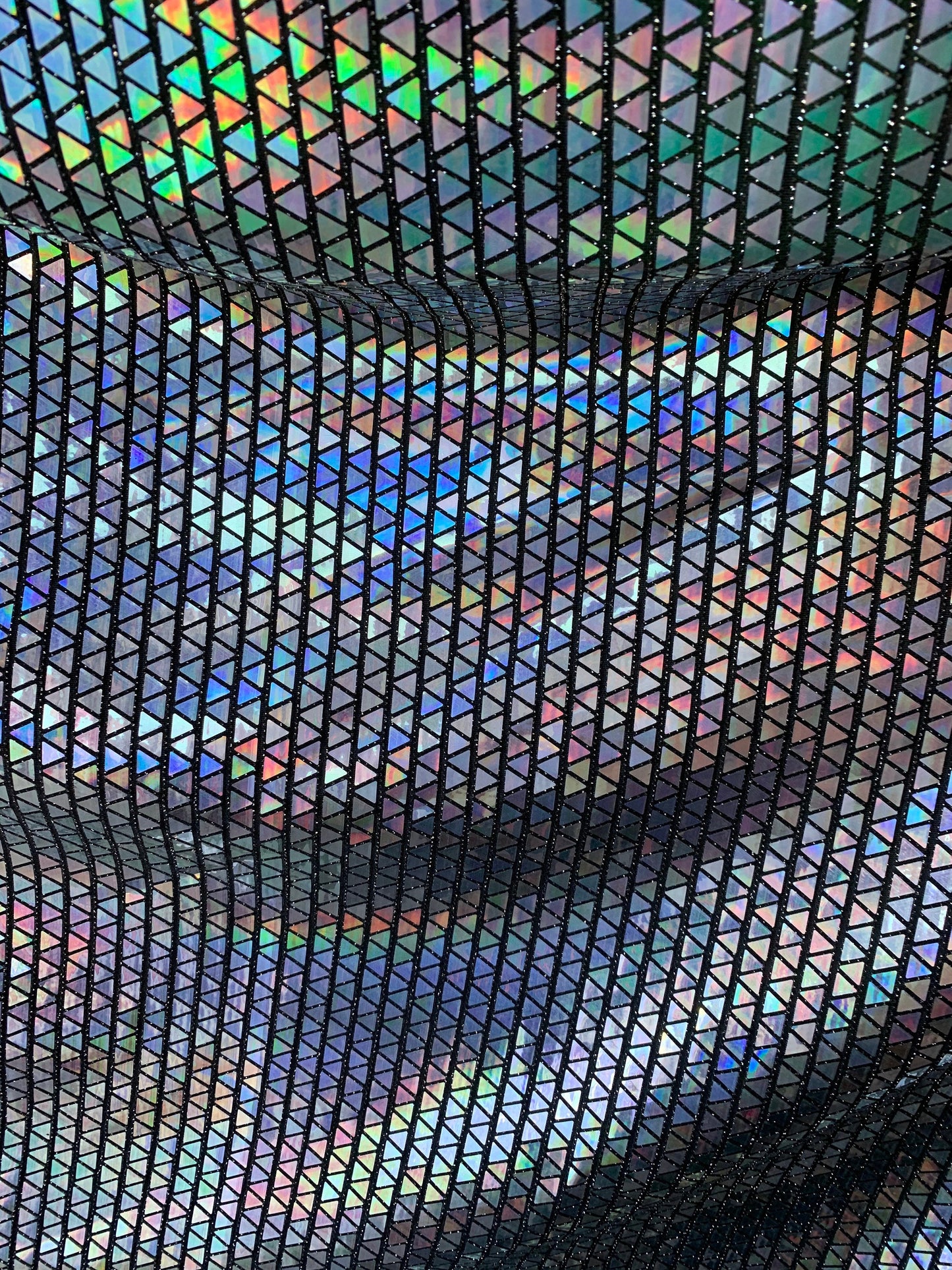 New triangle sequins Hologram Iridescent black on metallic base non stretch 58/60" Sold by the YD. Ships worldwide from Los Angeles C.A USA.