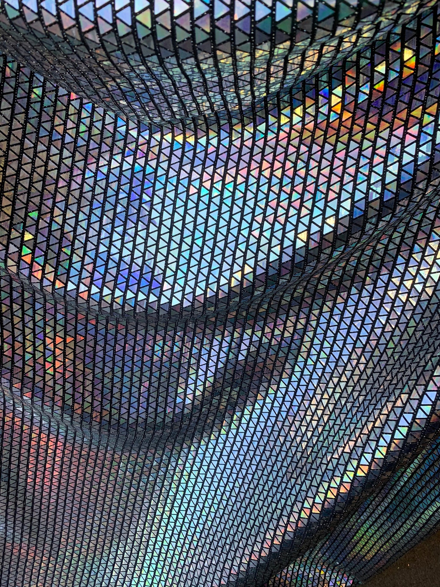 New triangle sequins Hologram Iridescent black on metallic base non stretch 58/60" Sold by the YD. Ships worldwide from Los Angeles C.A USA.