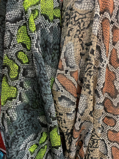 New stretch mesh exotic snake design it glows in the dark 4-way Stretch 58/60” Sold by the YD. Ships worldwide from Los Ángeles California