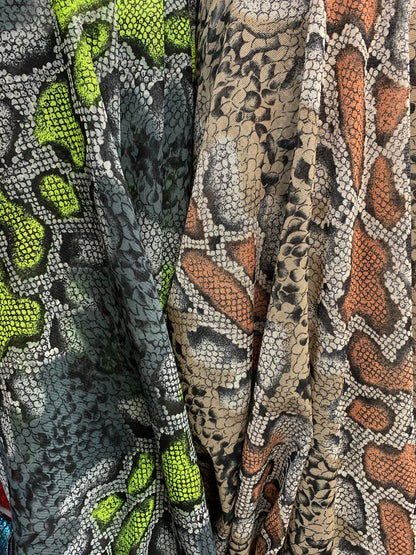 New stretch mesh exotic snake design it glows in the dark 4-way Stretch 58/60” Sold by the YD. Ships worldwide from Los Ángeles California