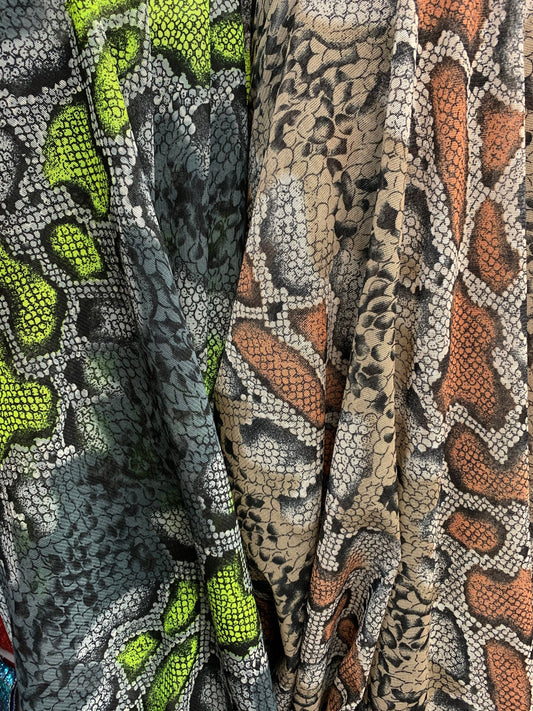 New stretch mesh exotic snake design it glows in the dark 4-way Stretch 58/60” Sold by the YD. Ships worldwide from Los Ángeles California
