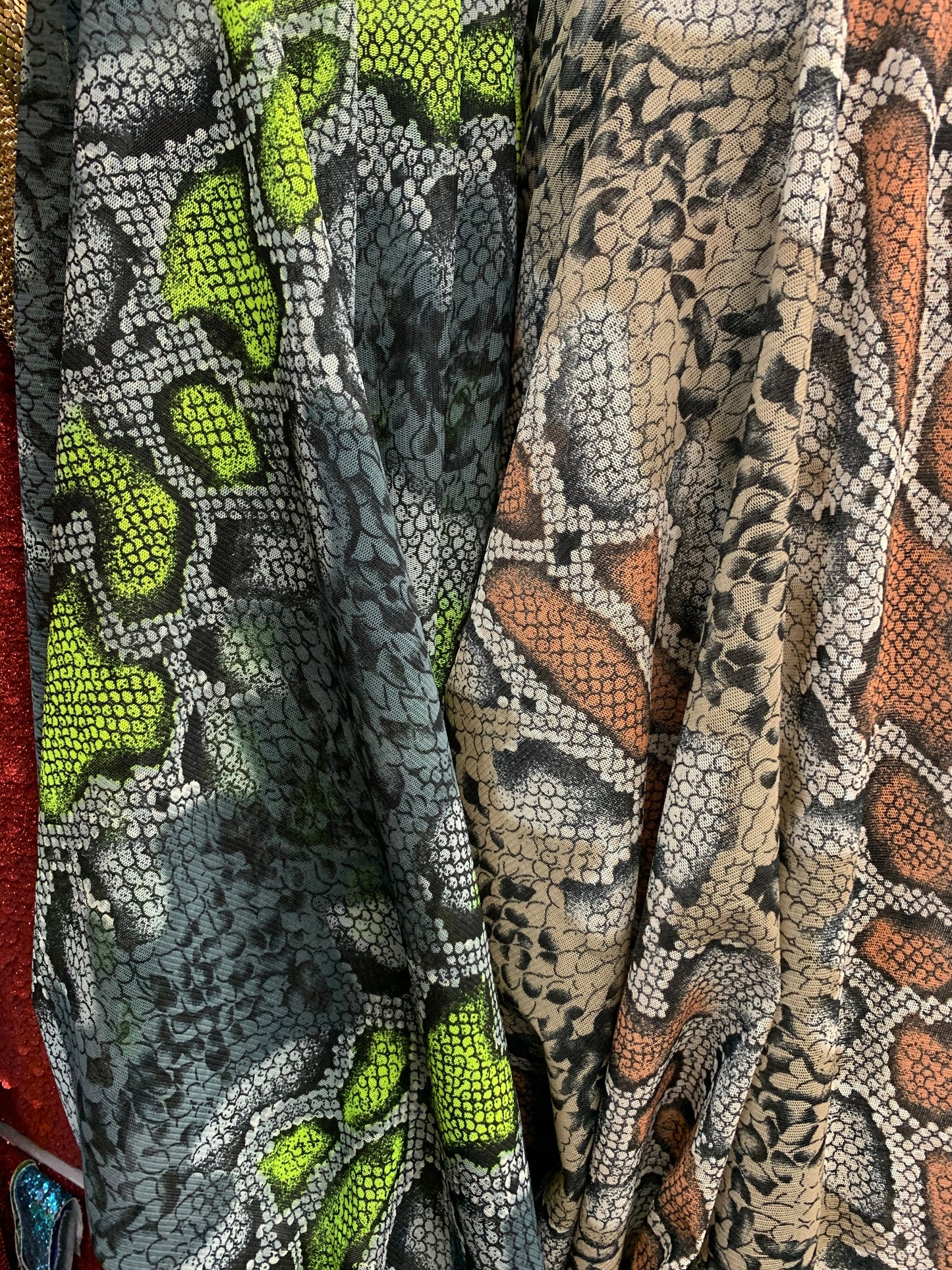 New stretch mesh exotic snake design it glows in the dark 4-way Stretch 58/60” Sold by the YD. Ships worldwide from Los Ángeles California