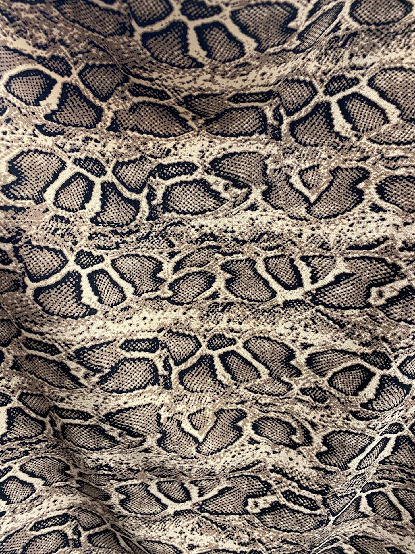 New snake design print on poly spandex 2-way stretch 58/60” Sold by the YD. Ships worldwide from Los Angeles California USA.