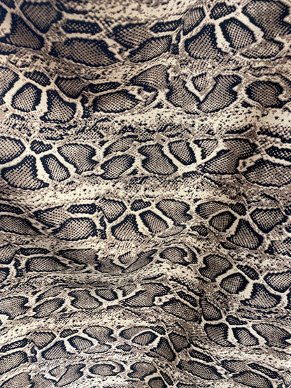 New snake design print on poly spandex 2-way stretch 58/60” Sold by the YD. Ships worldwide from Los Angeles California USA.