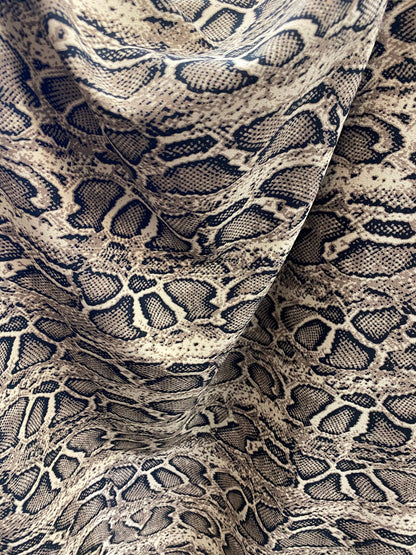 New snake design print on poly spandex 2-way stretch 58/60” Sold by the YD. Ships worldwide from Los Angeles California USA.