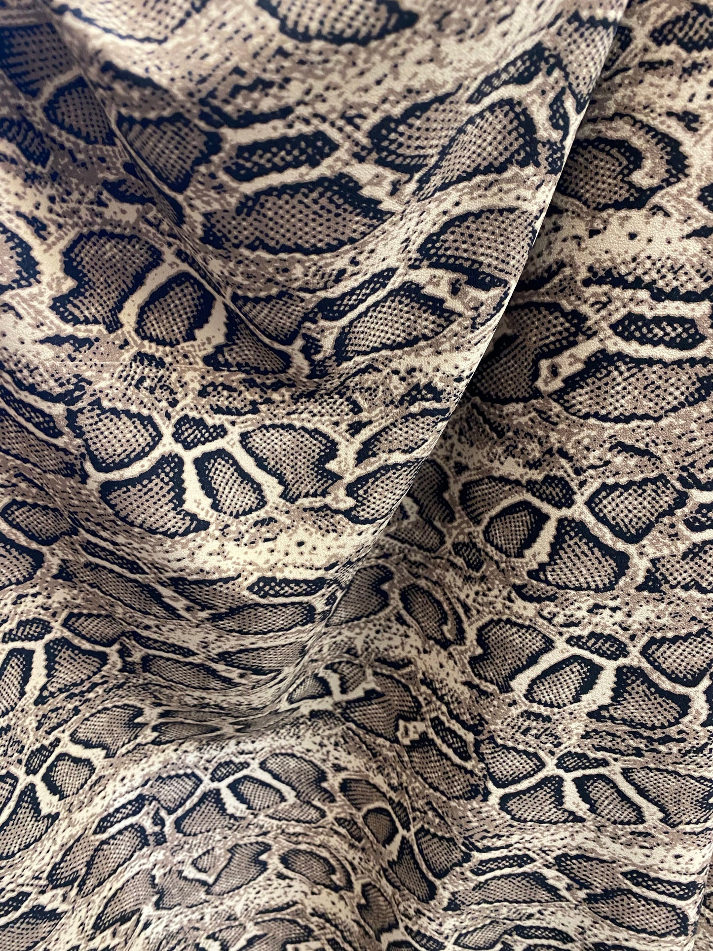 New snake design print on poly spandex 2-way stretch 58/60” Sold by the YD. Ships worldwide from Los Angeles California USA.