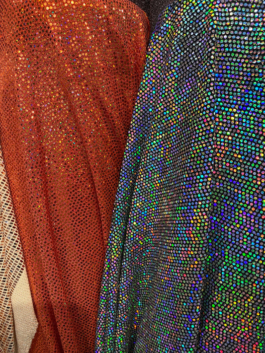 New metallic poly spandex with mini hologram sequins 2-way stretch 58/60” Sold by the YD. Ships worldwide from Los Ángeles California USA.