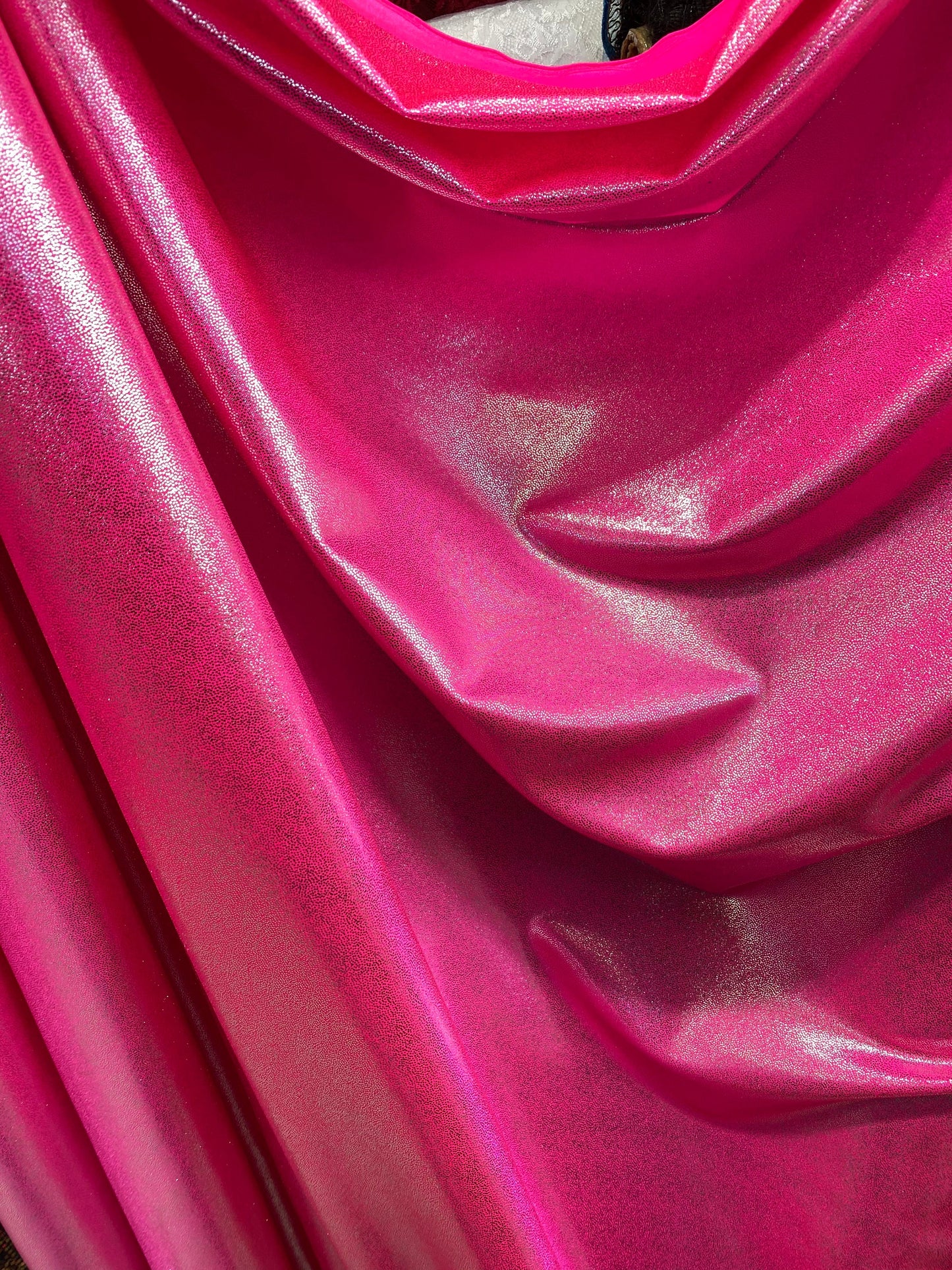 New foggy foil metallic nylon spandex neon pink/silver 4-way stretch 58/60” Sold by the YD. Ships worldwide from Los Angeles California USA.