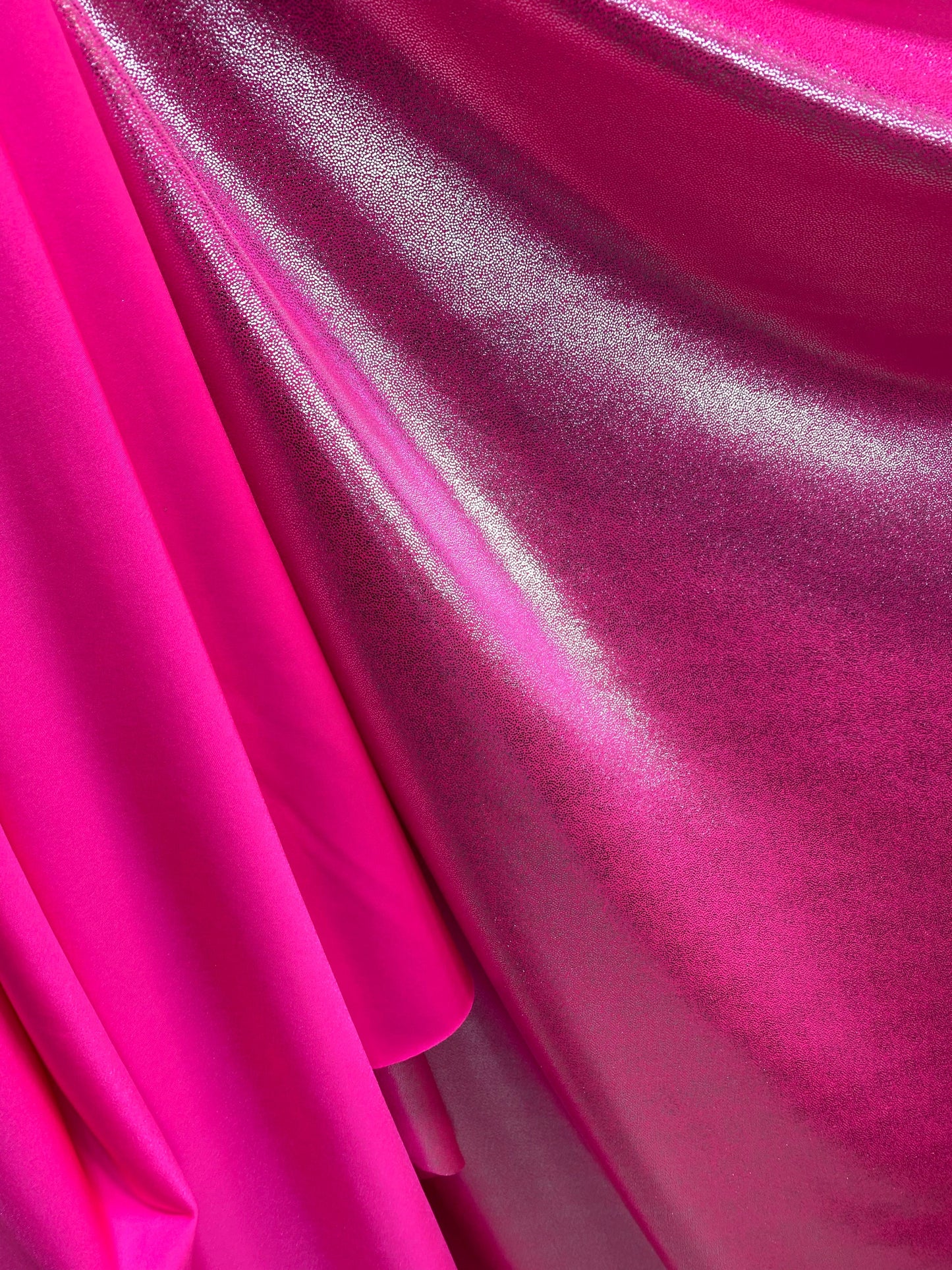 New foggy foil metallic nylon spandex neon pink/silver 4-way stretch 58/60” Sold by the YD. Ships worldwide from Los Angeles California USA.