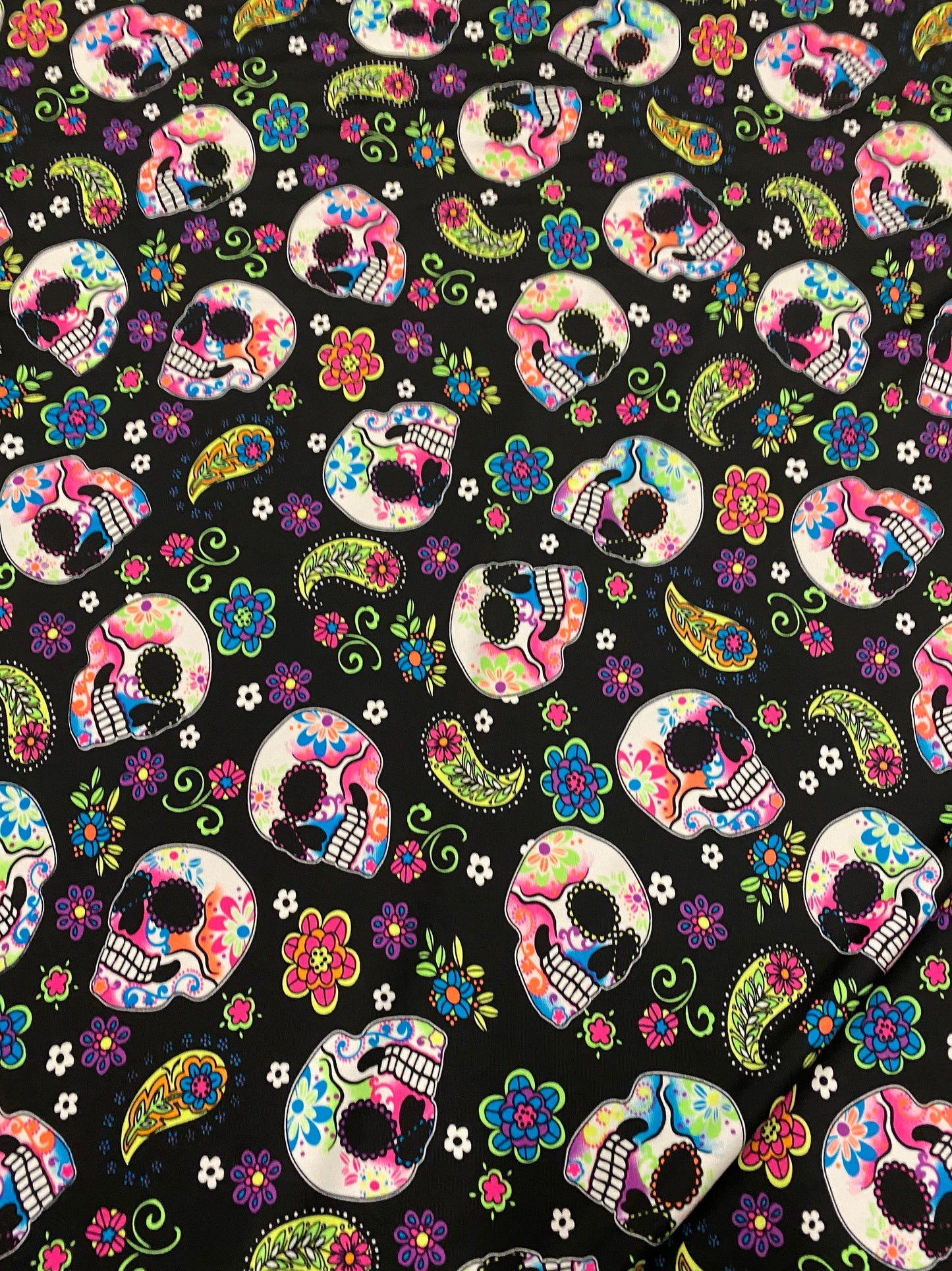 New skulls design black/multicolor nylon spandex print 4-way stretch 58/60”  Sold by the YD. Ships worldwide from Los Ángeles California USA