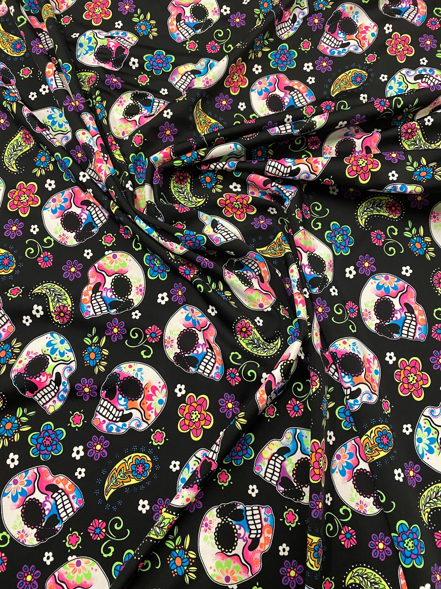 New skulls design black/multicolor nylon spandex print 4-way stretch 58/60”  Sold by the YD. Ships worldwide from Los Ángeles California USA