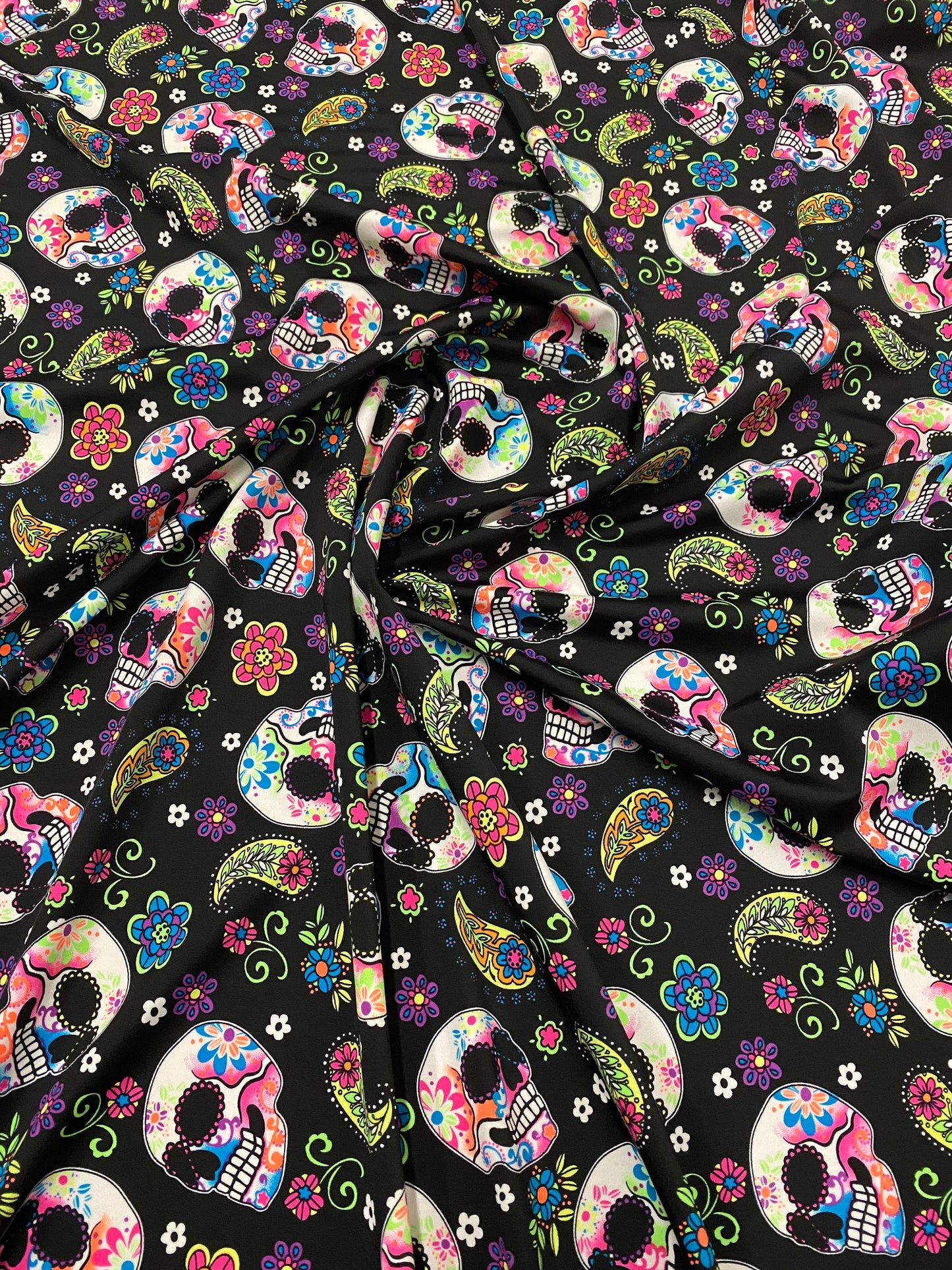 New skulls design black/multicolor nylon spandex print 4-way stretch 58/60”  Sold by the YD. Ships worldwide from Los Ángeles California USA