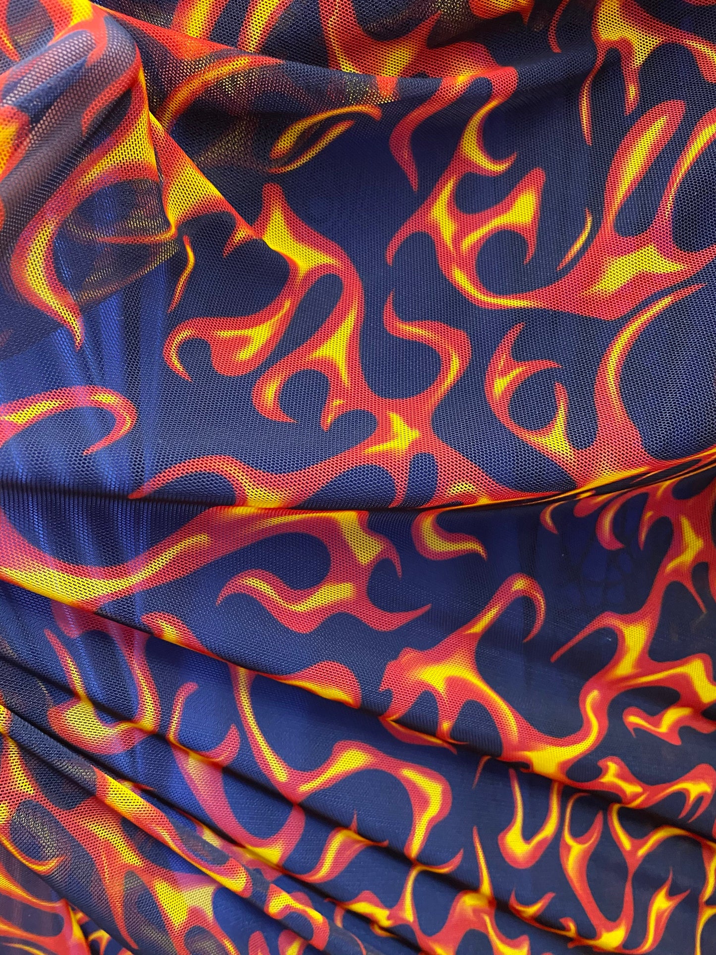 New power mesh Hot flames design nylon mesh 4-way stretch 58/60” Sold by the YD. Ships worldwide from Los Angeles California USA.