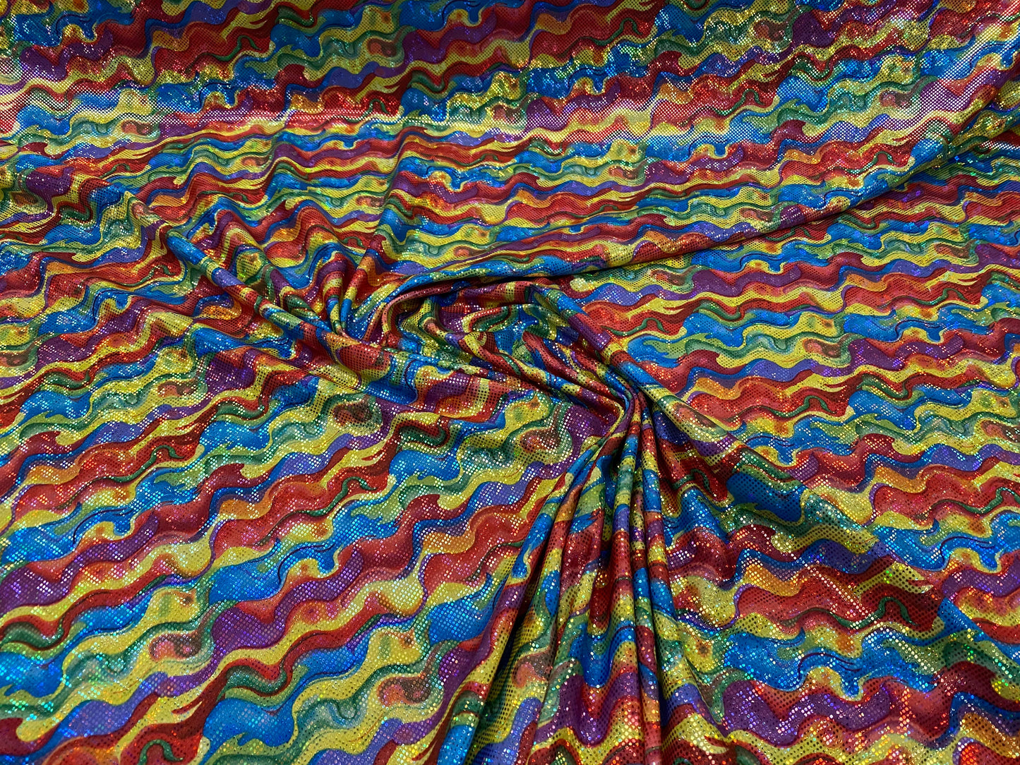 New shattered glass hologram multicolor lava design nylon spandex 4way stretch 58/60” Sold by the YD. Ships worldwide from Los Angeles CA US