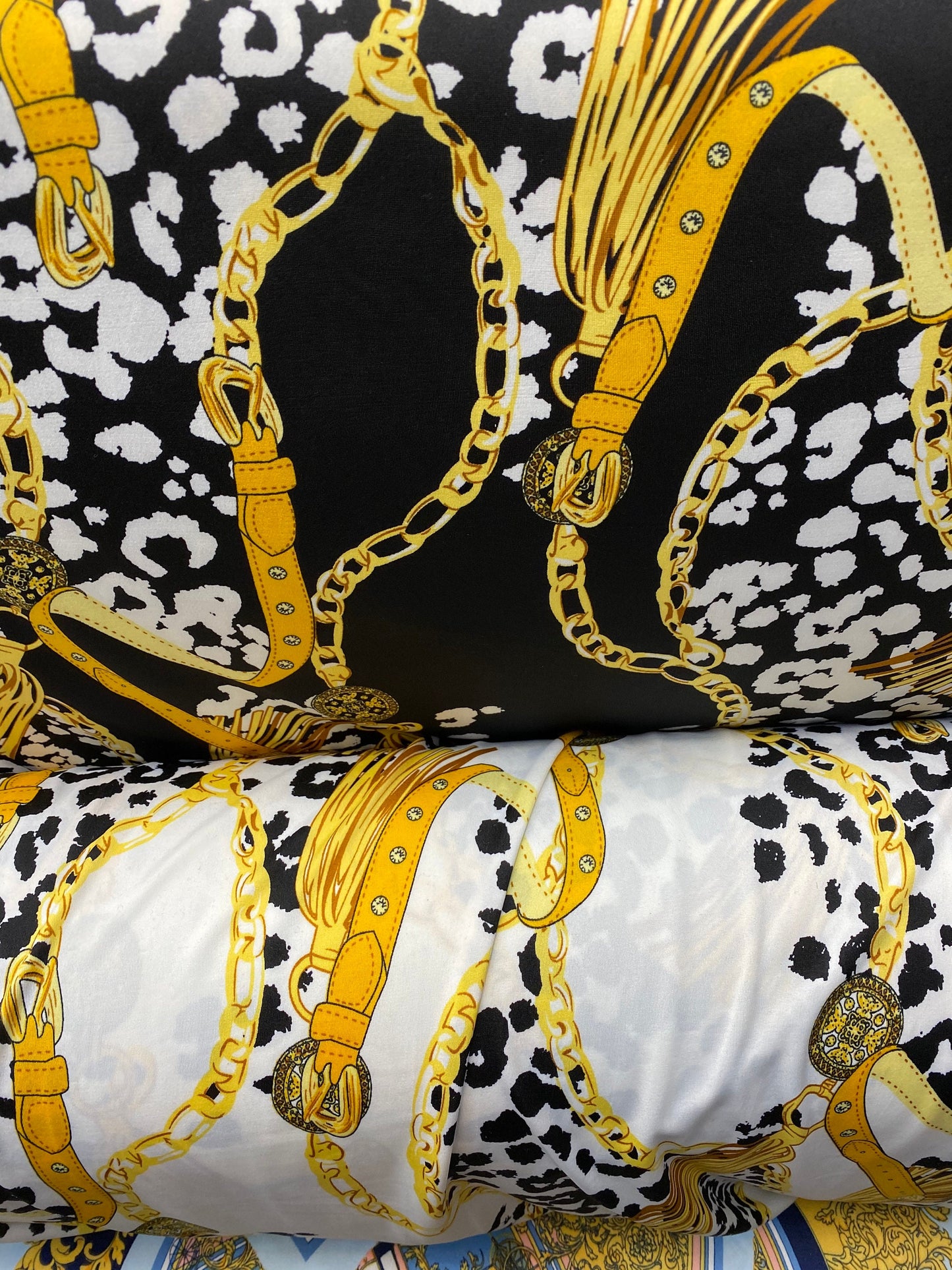 New animal print with gold chain design print on poly spandex 2-way stretch medium weight 58/60” Sold by the YD. Ships worldwide from USA.