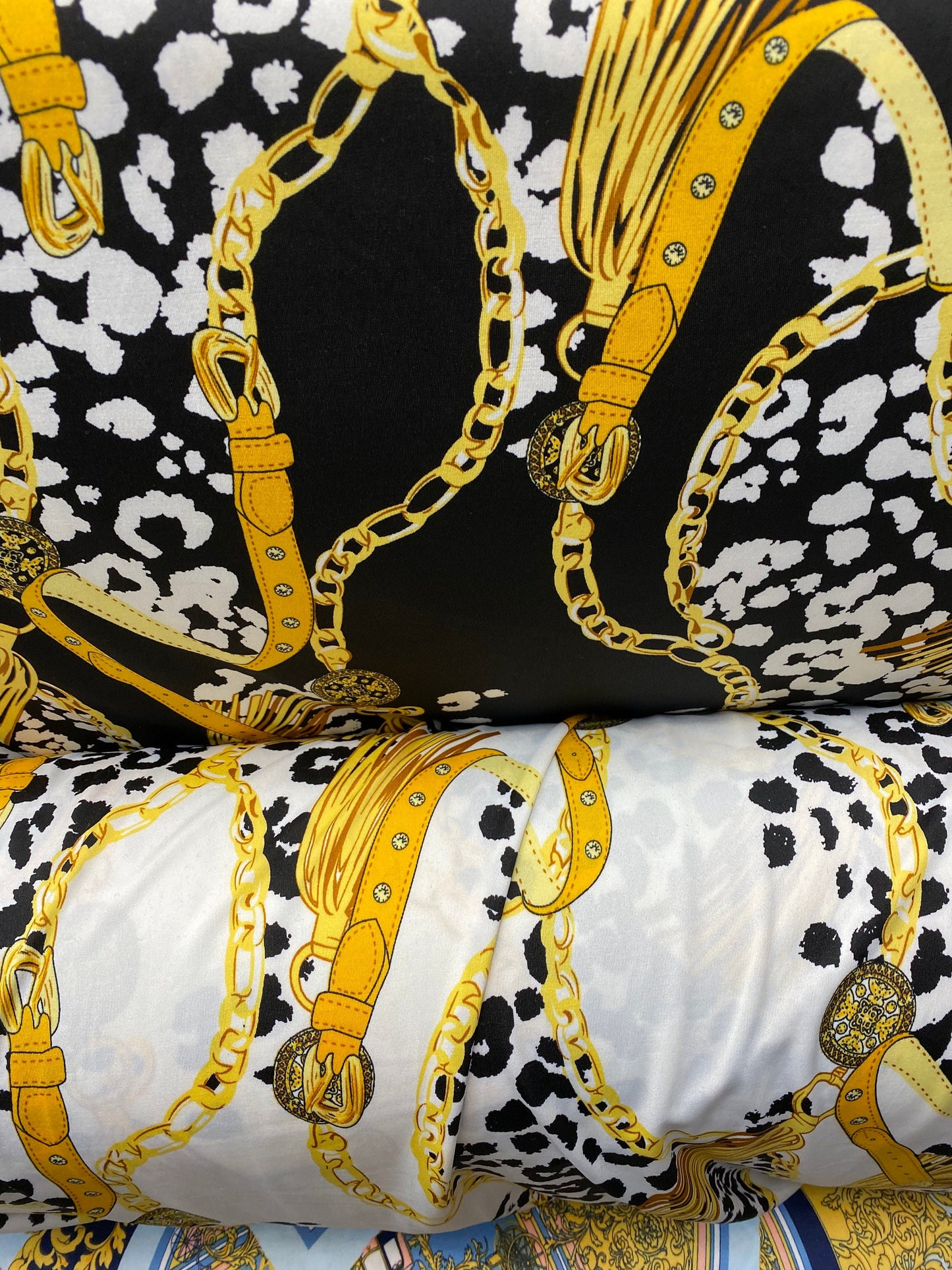 New animal print with gold chain design print on poly spandex 2-way stretch medium weight 58/60” Sold by the YD. Ships worldwide from USA.