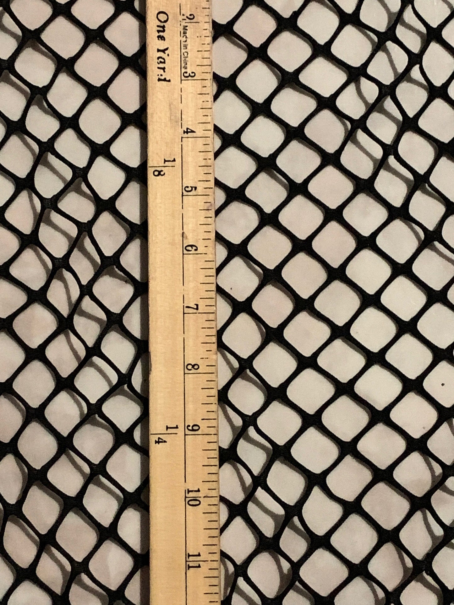 New Fishnet jumbo size black spandex mesh 4-way 58/60” Sold by the YD. Ships worldwide from Los Angeles California USA.
