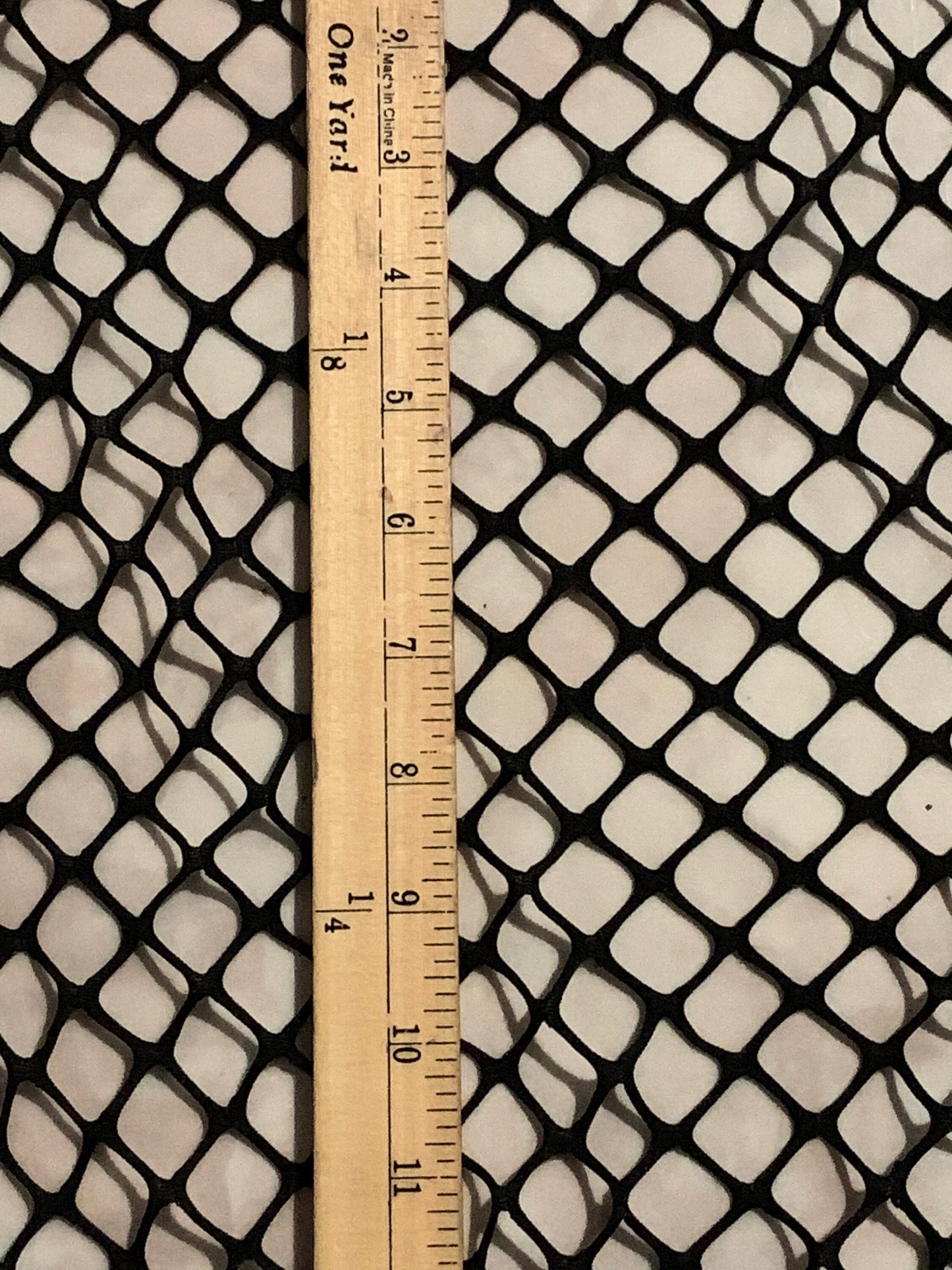 New Fishnet jumbo size black and white  spandex mesh 4-way 58/60” Sold by the YD. Ships worldwide from Los Angeles California USA.