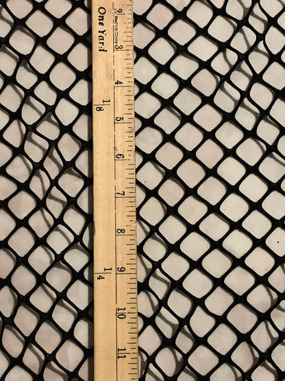 New Fishnet jumbo size black and white  spandex mesh 4-way 58/60” Sold by the YD. Ships worldwide from Los Angeles California USA.