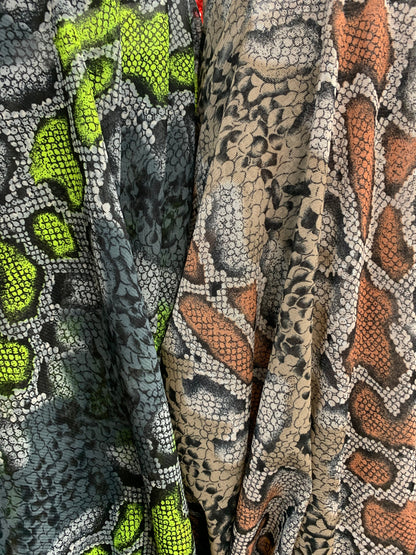 New stretch mesh exotic snake design it glows in the dark 4-way Stretch 58/60” Sold by the YD. Ships worldwide from Los Ángeles California