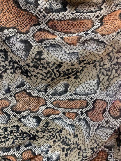 New exotic snake design taupe/black print on stretch mesh 4-way 58/60” Sold by the YD. Ships worldwide from Los Angeles California USA.