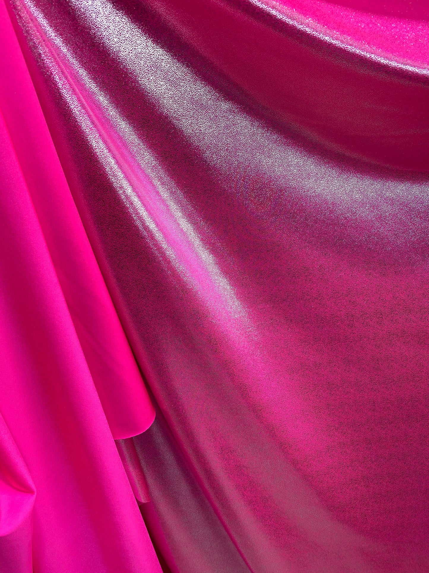 New foggy foil metallic nylon spandex neon pink/silver 4-way stretch 58/60” Sold by the YD. Ships worldwide from Los Angeles California USA.