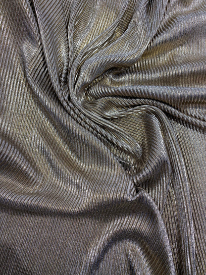 New metallic poly pleated black/gold medium weight fabric 2-way stretch 58/60” Sold by the YD. Ships worldwide from Los Angeles CA USA.