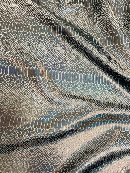 New Iridescent snake design silver/gray metallic hologram nylon spandex 4-way stretch 58/60” Sold by the YD. Ships worldwide from L.A CA.