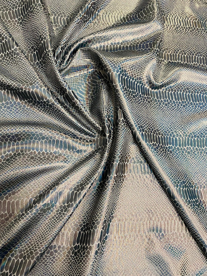 New Iridescent snake design silver/gray metallic hologram nylon spandex 4-way stretch 58/60” Sold by the YD. Ships worldwide from L.A CA.