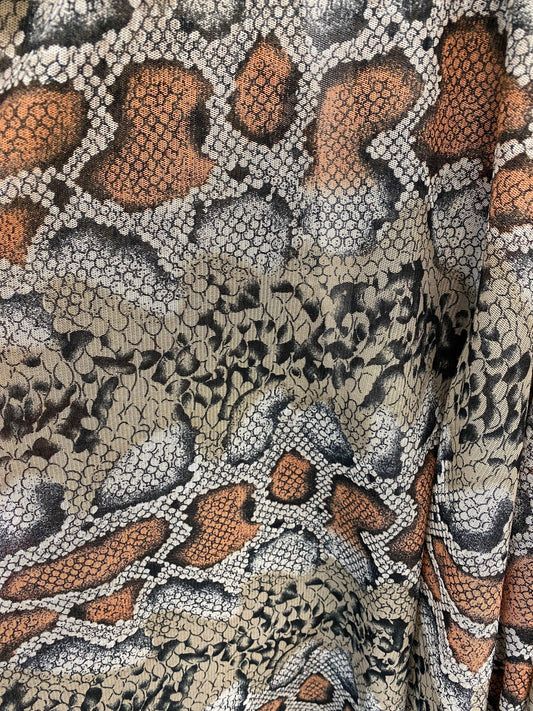 Exotic snake design Nude/black 2-tone print on stretch mesh 4-way 58/60” Sold by the YD. Ships worldwide from Los Angeles California USA.