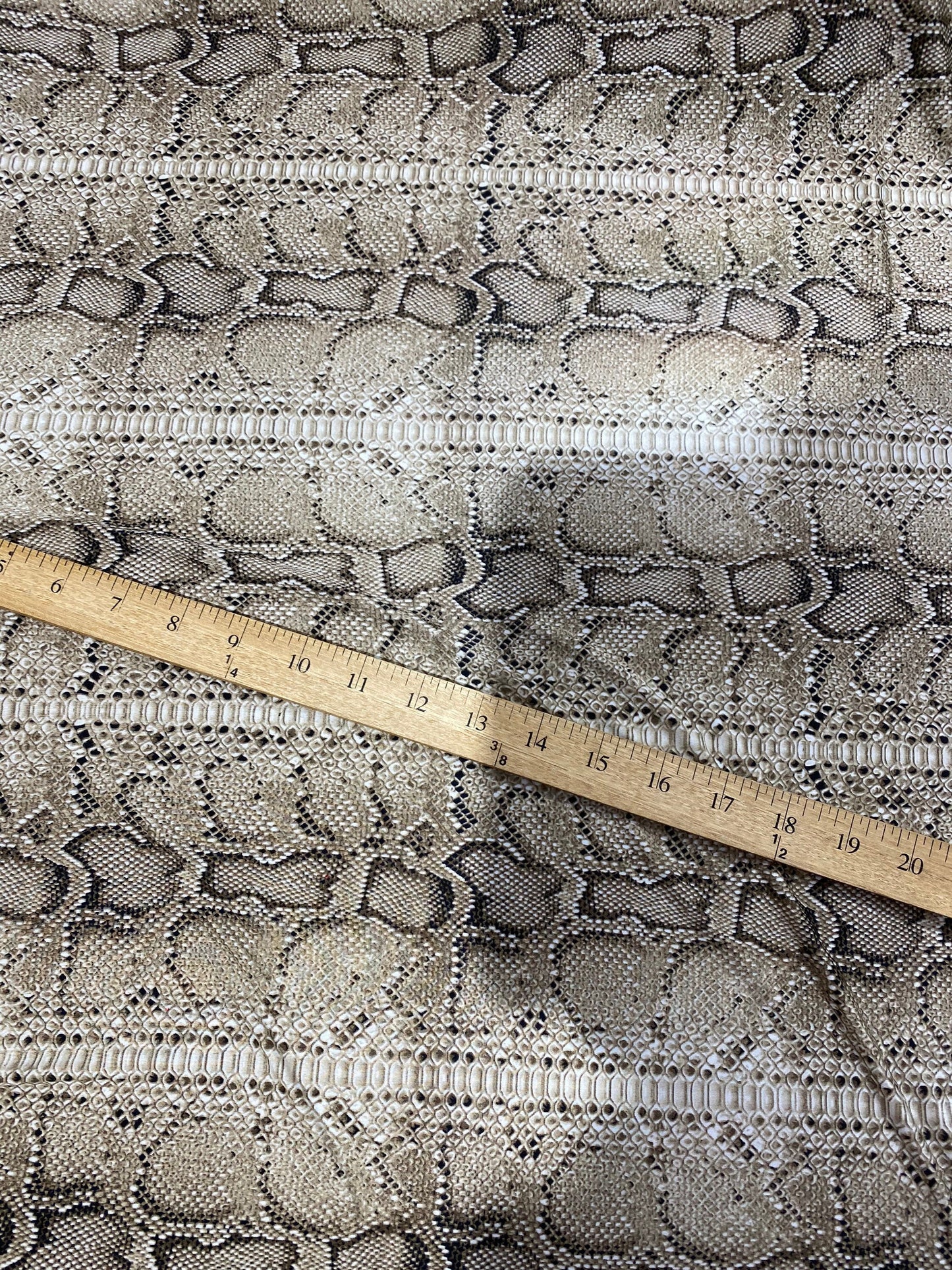 New exotic snake design taupe/black medium weight 4-way stretch 58/60” Sold by the YD. Ships worldwide from Los Angeles California USA.