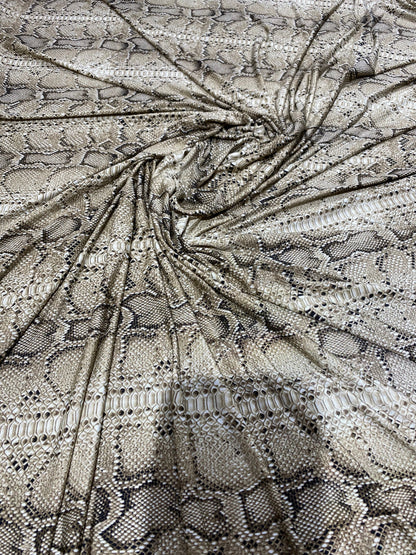New exotic snake design taupe/black medium weight 4-way stretch 58/60” Sold by the YD. Ships worldwide from Los Angeles California USA.