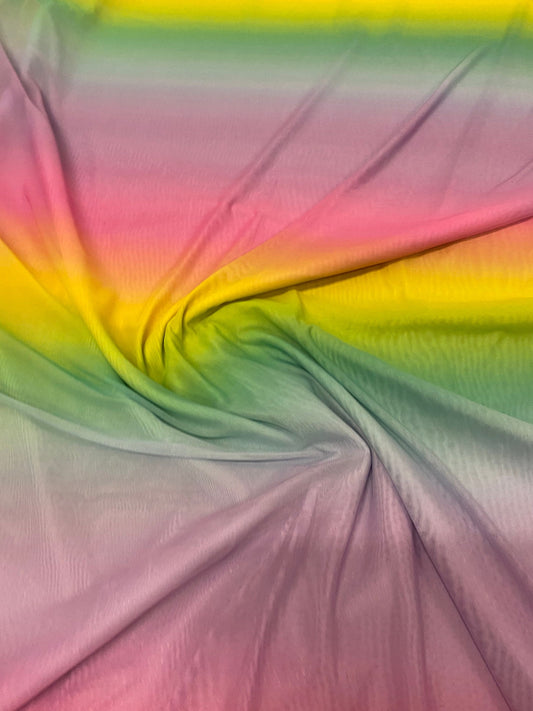 New rainbow design power mesh 4-way stretch nylon quality 58/60” Sold by the YD. Ships worldwide from Los Angeles California USA.