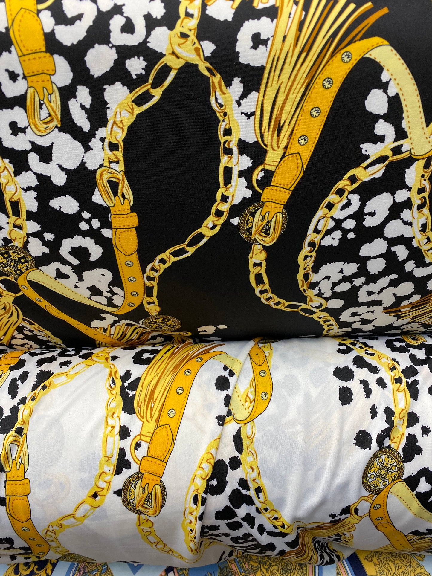 New animal print with gold chain design print on poly spandex 2-way stretch medium weight 58/60” Sold by the YD. Ships worldwide from USA.