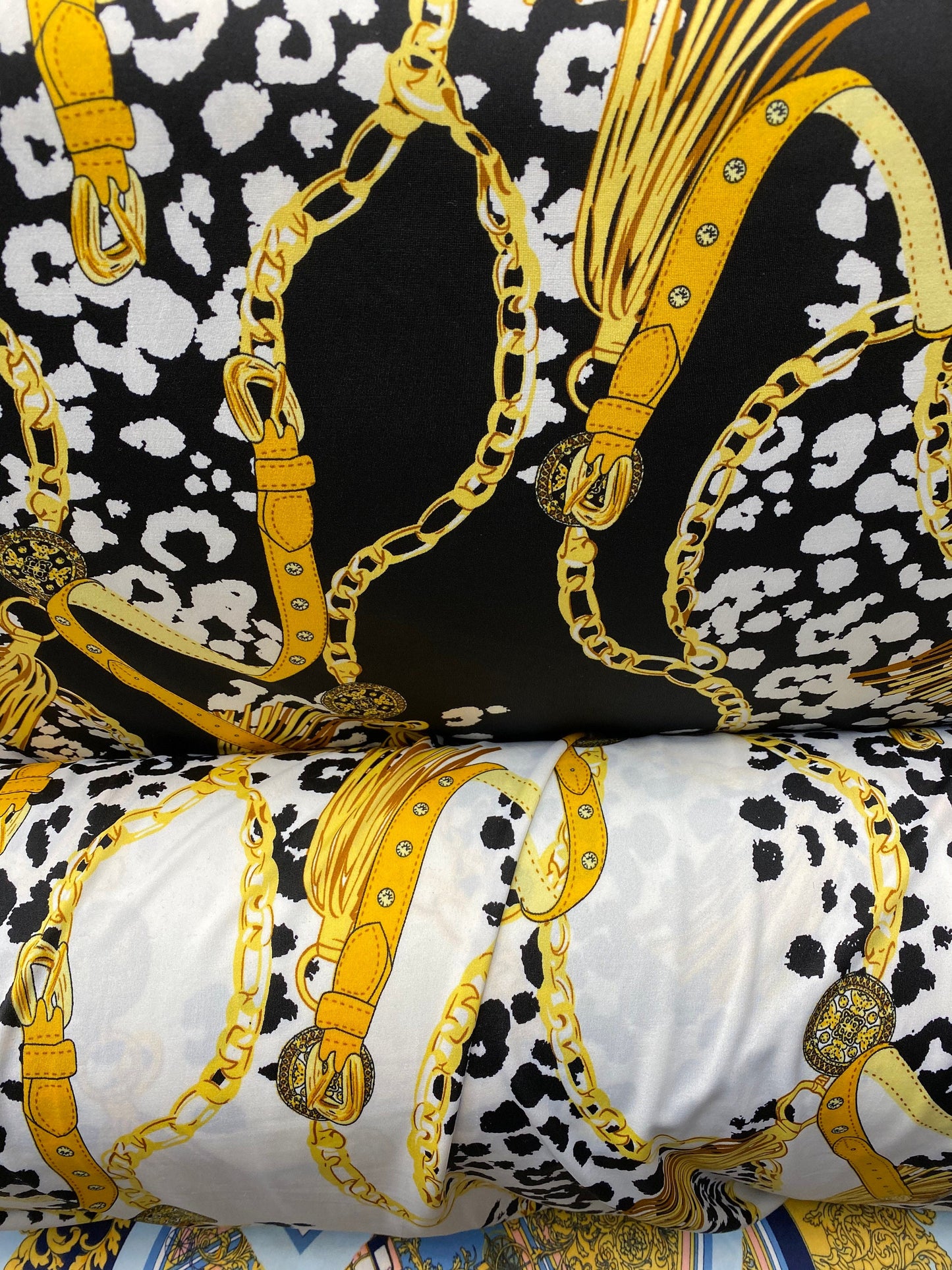 New animal print with gold chain design print on poly spandex 2-way stretch medium weight 58/60” Sold by the YD. Ships worldwide from USA.