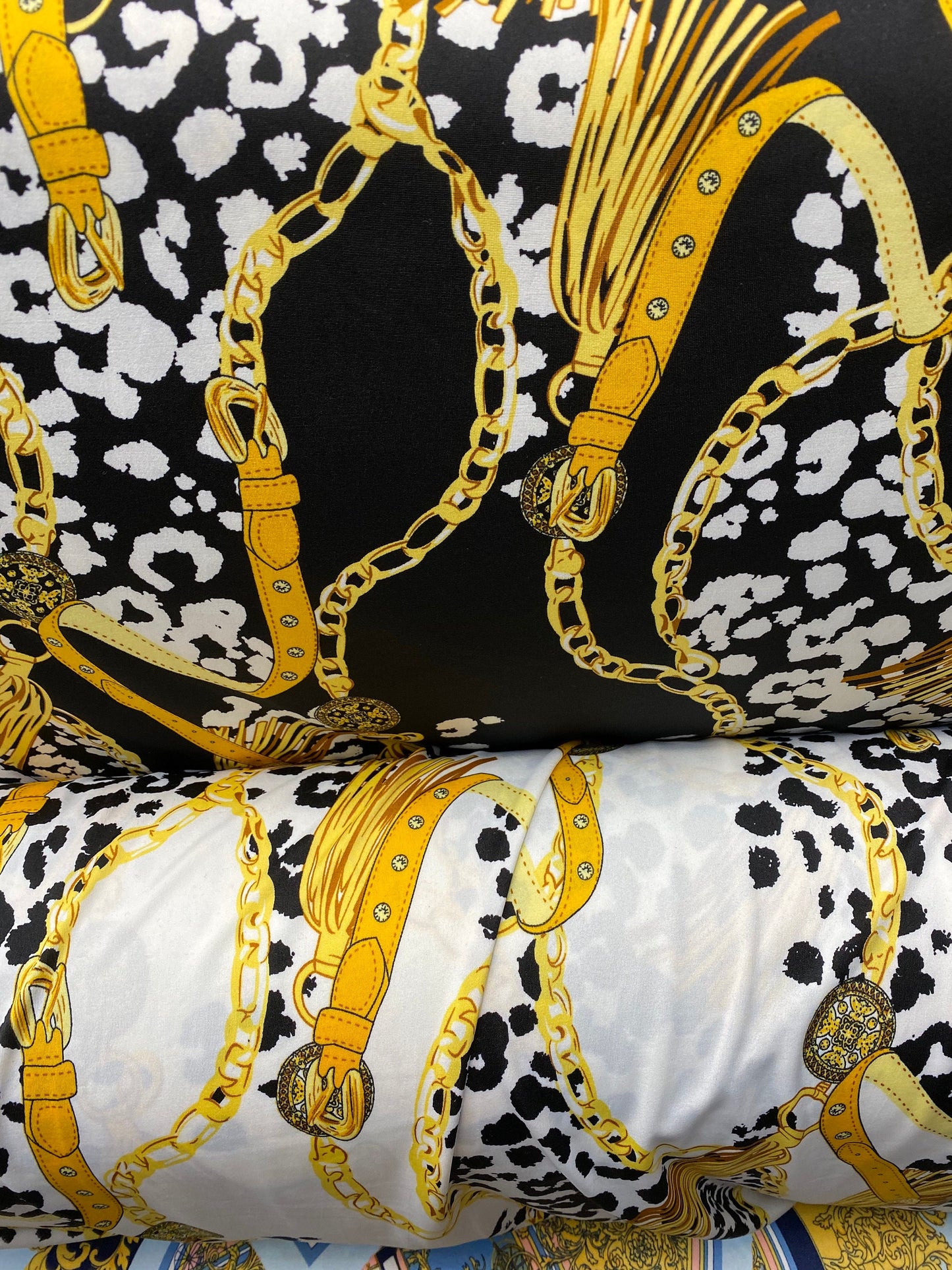 New animal print with gold chain design print on poly spandex 2-way stretch medium weight 58/60” Sold by the YD. Ships worldwide from USA.