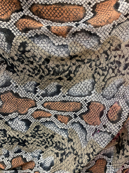 New exotic snake design taupe/black print on stretch mesh 4-way 58/60” Sold by the YD. Ships worldwide from Los Angeles California USA.