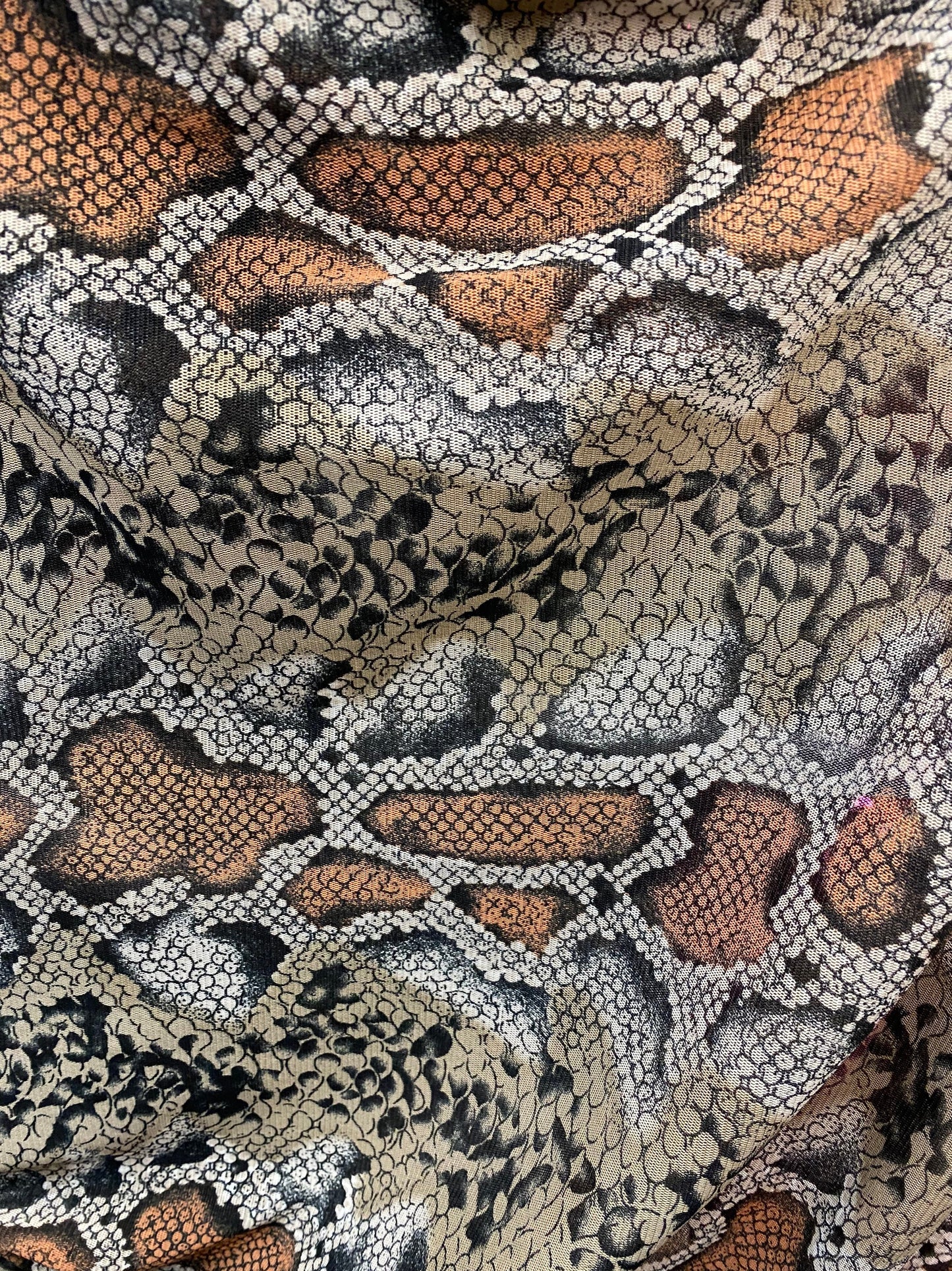 New exotic snake design taupe/black print on stretch mesh 4-way 58/60” Sold by the YD. Ships worldwide from Los Angeles California USA.